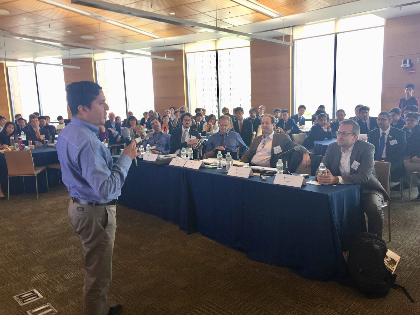 Judge Muk Rao of Wharton Research Data Services offers some inspiring parting shots to the crowd, while his fellow judging panel -- including (l-r) Saras Agarwal, Iain Gillespie, David Lawrence, John Squires and Scott Stimpfel -- looks on.