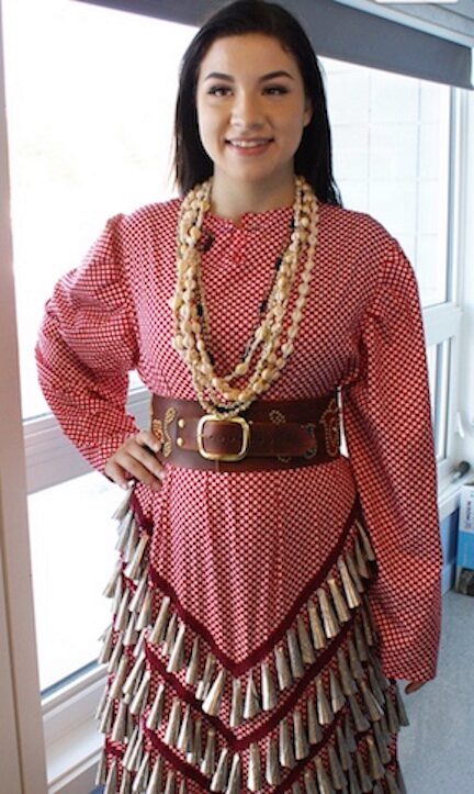 This photo from Anishinaabe Bimishimo’s website shows Émilie McKinney wearing her company's jingles.