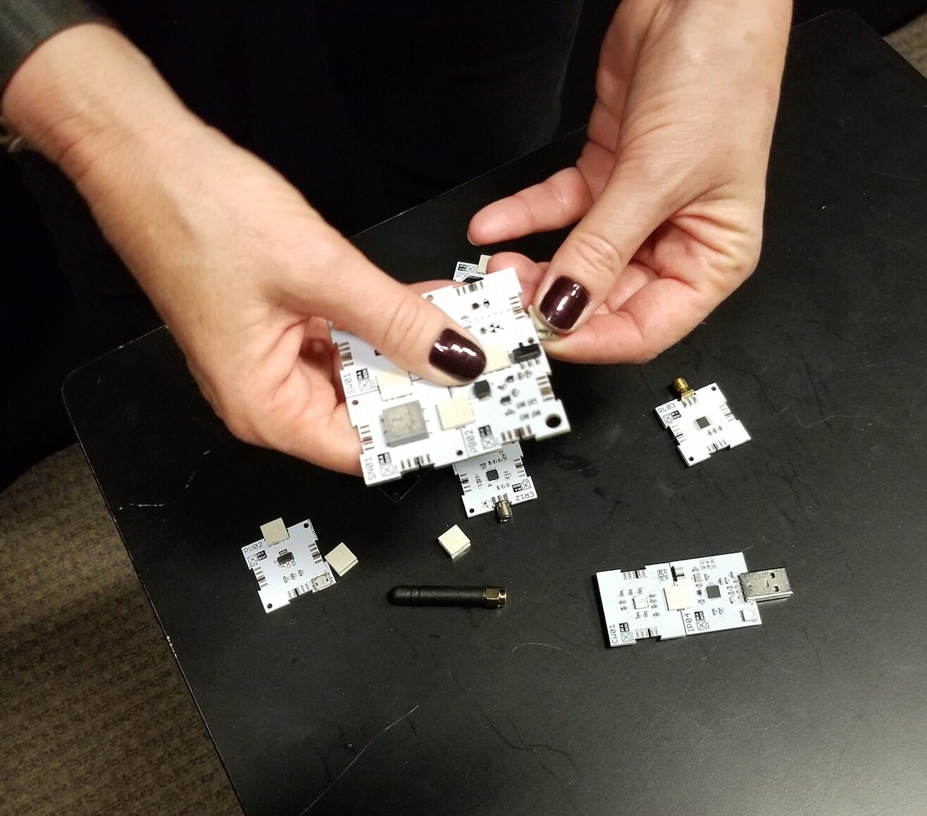 XinaBox components fit together with small connectors to create electronic circuits.