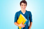 A person wearing a blue shirt, smiling and holding colorful binders against a light blue background.