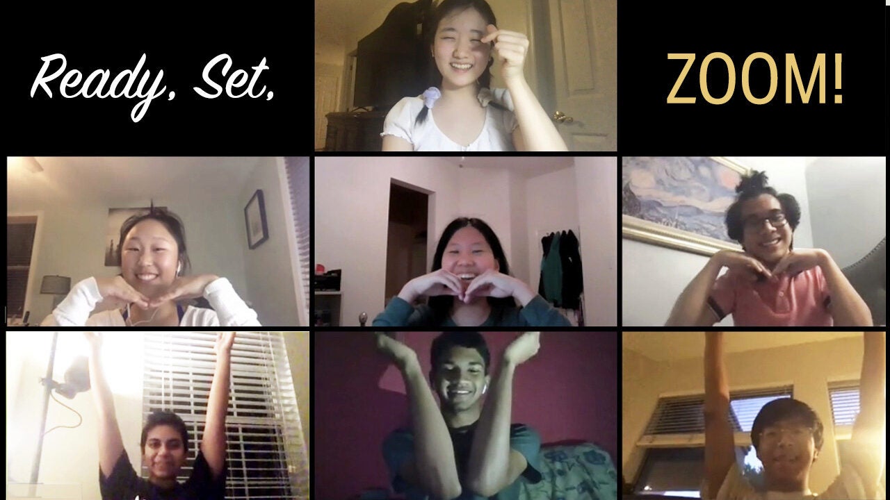 A collage of six people on a video call, each making playful hand gestures. The top text reads, "Ready, Set, ZOOM!"