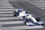 blue and white formula one motorsports car driving on paved track.