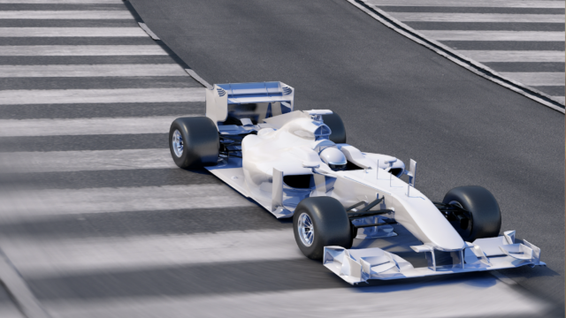 blue and white formula one motorsports car driving on paved track.